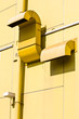 Air vent on yellow wall