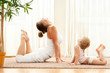 Foto: Mother and daughter doind exercise Mother and daughter doind exercise