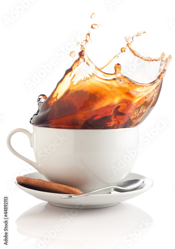 Photo: coffee splash in a cup coffee splash in a cup