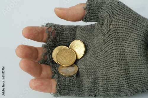 Photo: hand into the glove of a poor beggar hand into the glove of a poor beggar