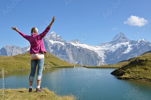 Photo: Traveler against Swiss Alps Traveler against Swiss Alps