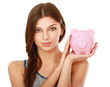 Young beautiful woman standing with piggy bank (money box)