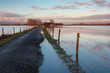 Road to a Dutch farm flooded by water from the river IJssel