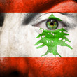 Flag painted on face with green eye to show Lebanon support
