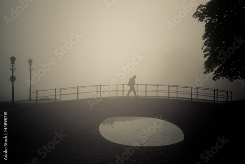 Photo: Lonely walker in a misty morning Lonely walker in a misty morning