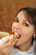 Beautiful woman sitting at a table with a cake