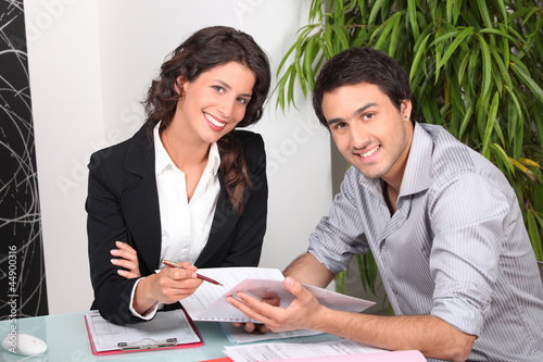 Photo: Businesswoman discussing a contract with her client Businesswoman discussing a contract with her client