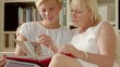 Video: Mother and daughter looking at pictures in photo album Mother and daughter looking at pictures in photo album