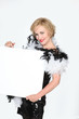 Woman in a vintage dress holding an empty publicity poster