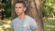 Video: Sad, depressed young man in the park, steadicam shot Sad, depressed young man in the park, steadicam shot
