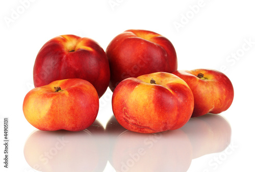 Photo: Ripe nectarines isolated on white close-up Ripe nectarines isolated on white close-up