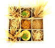 Nine types of pasta in wooden box sections isolated on white