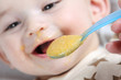 Baby boy eating vegetable mash