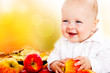 Photo: Baby holding apples Baby holding apples