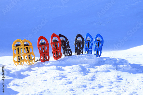 Photo: Snowshoeing. Snowshoes in the snow. Snowshoeing. Snowshoes in the snow.