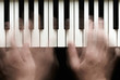 Hands playing piano. Motion blur