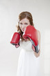 Beautiful bride in boxing gloves