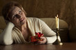 Nice Caucasian aged woman sitting