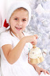 Girl hold Christmas bell