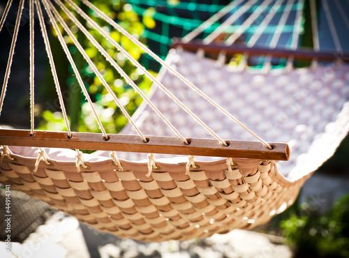 Photo: Hammock hanging in the sunny yard Hammock hanging in the sunny yard