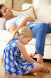 Daughter Painting Sleeping Father's Toenails At Home