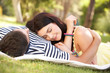 Couple Relaxing Together In Garden