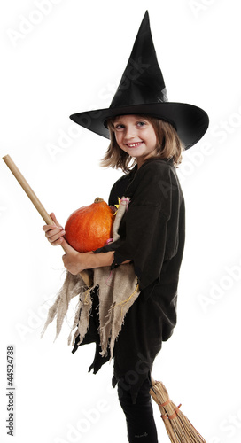 Photo: little hallowen witch with broom and pumpkin little hallowen witch with broom and pumpkin