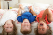 Photo: Children Lying Upside Down Bed Children Lying Upside Down Bed