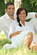 portrait of beautiful couple dressed in white