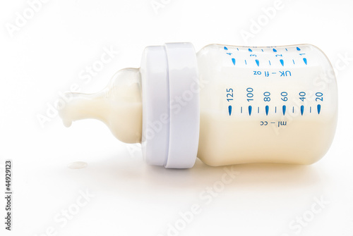 Photo: baby bottle with milk with clipping path baby bottle with milk with clipping path