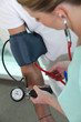 Photo: Doctor taking patient's blood pressure Doctor taking patient's blood pressure