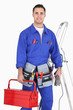 Electrician with a toolbox and cables