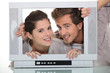 Couple in a television screen