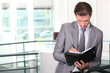 Businessman writing in diary