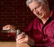 Caucasian adult male with a nice bottle sitting