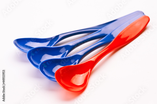 Photo: recyclable plastic spoons; on white base recyclable plastic spoons; on white base