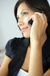 Photo: Close-up of brunette using her phone Close-up of brunette using her phone