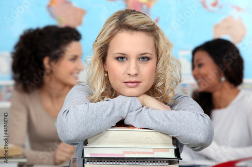 Photo: Woman in the classroom with her books Woman in the classroom with her books