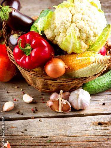 Photo: Healthy Organic Vegetables on the Wooden Background Healthy Organic Vegetables on the Wooden Background