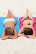 Girls sunbathing on the beach