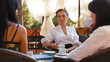 Female Excited Conversation in Outdoor Cafe