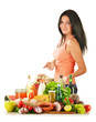 Young woman with variety of grocery products