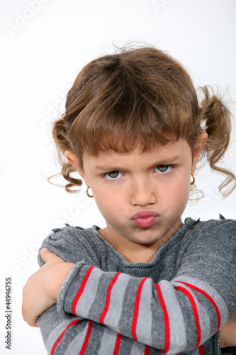 Photo: Angry little girl grinning Angry little girl grinning