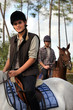 Couple riding horses together