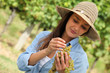 Woman with bunch of grapes