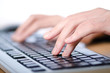 Hands typing on the keyboard