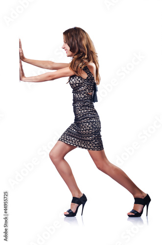 Photo: Young attractive woman pushing virtual obstacles Young attractive woman pushing virtual obstacles