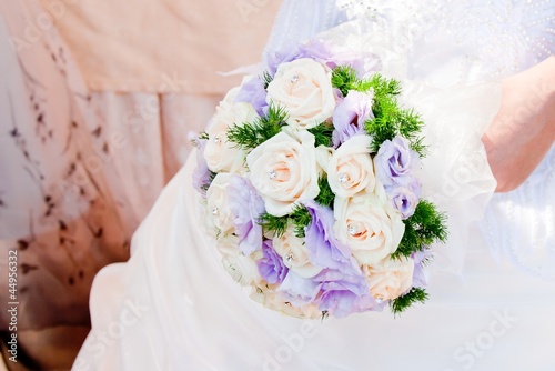 Photo: wedding bouquet at bride's hands wedding bouquet at bride's hands