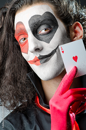 Photo: Joker with face mask in studio Joker with face mask in studio