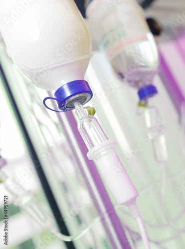 Photo: Infusion bottles with IV solution. infusion with medications. Infusion bottles with IV solution. infusion with medications.